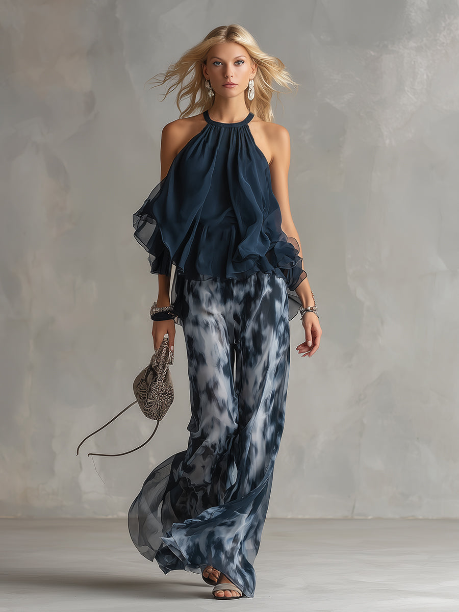 Luisa - Elegantes Chiffon-Kleid mit hochgeschlossenem Oberteil und weit geschnittenen, gemusterten Hosen.