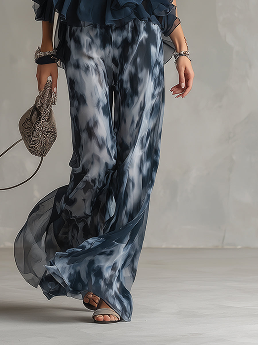 Luisa - Elegantes Chiffon-Kleid mit hochgeschlossenem Oberteil und weit geschnittenen, gemusterten Hosen.