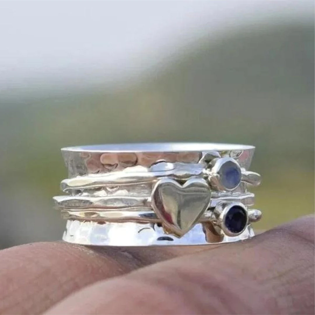 Eleganter drehbarer Herzring aus Silber